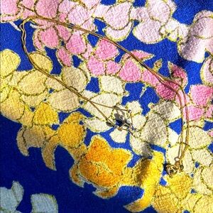 14K Gold necklace with swinging person pendant